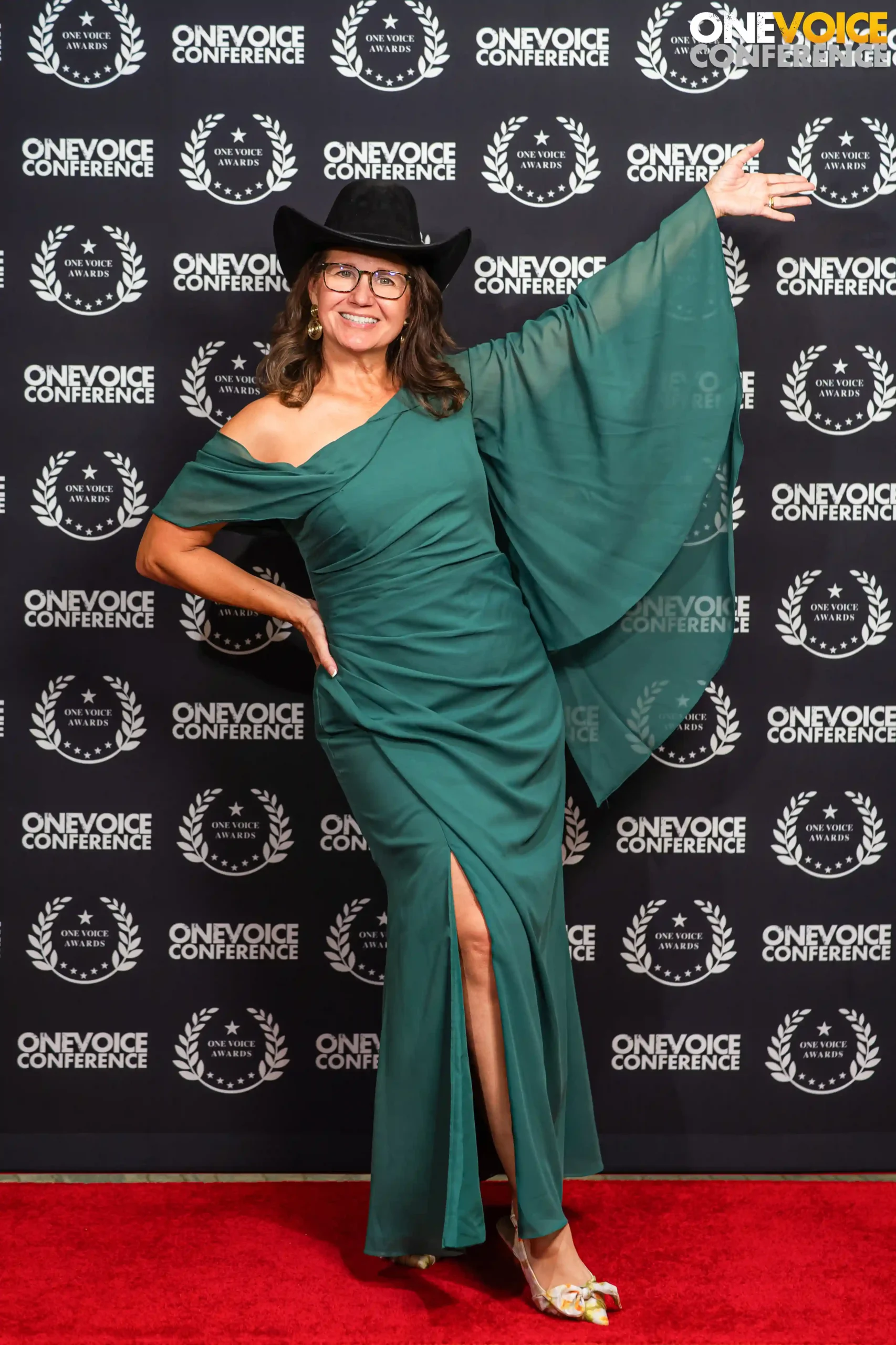 carrie drovdlic standing on the red carpet at the one voice awards for voice actors